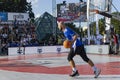 Urban basketball players playing basketball on sports court in Riga