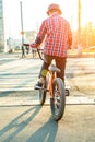 Urban biking - teenage boy riding bike in city Royalty Free Stock Photo