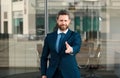 Urban business man. Casual businessman shaking hands. A businessman with an open hand ready to seal a deal. Royalty Free Stock Photo