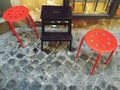Urban chair in a cobblestone road Royalty Free Stock Photo