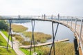 Urban city and peoples. Iron bridge on the lake. Green nature an