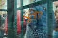 Urban city scene with orange graffiti on a glass window