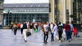 Urban Commuters, Tourist and Shoppers in daily rush outside the famous Main Train Station in Cologne, Germany