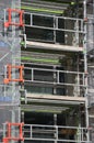 Urban construction site scaffolding to support work crew Royalty Free Stock Photo