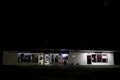 Urban convenience store at night distant view