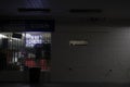 Urban convenience store at night partial window view