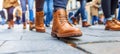 Urban crowd walking in city, focus on diverse legs in stylish shoes on bustling street