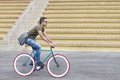 Urban cyclist riding with messenger bag