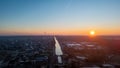 Urban Dawn: Sunrise Over the City with A Distant Wind Farm Royalty Free Stock Photo