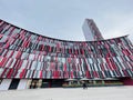 Urban design with facade of a large building against a clear blue sky Royalty Free Stock Photo