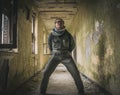 An urban explorer is in an old abandoned building discovering the scary things there is to see Royalty Free Stock Photo