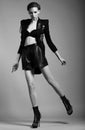 Urban Fashion. Trend. Exquisite Woman in Short Skirt. Black & White