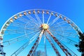 Urban Ferris wheel on sunny day Royalty Free Stock Photo