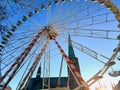 Urban Ferris wheel on sunny day Royalty Free Stock Photo