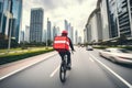 Urban food delivery service by a cyclist with city skyscrapers as a backdrop Royalty Free Stock Photo