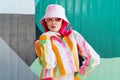Urban Fresh street fashion look. Vanilla Girl. Kawaii vibes. Candy colors design. Bucket hat trends. Young woman with