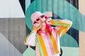 Urban Fresh street fashion look. Vanilla Girl. Kawaii vibes. Candy colors design. Bucket hat trends. Young woman with