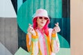 Vanilla Girl. Kawaii vibes. Candy colors design. Young woman with pink hair and sun glasses in bucket hat and multicolor