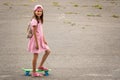 Urban girl ride with penny skateboard