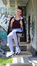 Urban girl sitting on rusted stairs Royalty Free Stock Photo