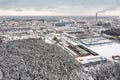 urban industrial area in winter. factory buildings  warehouses and thermal power plant on gray sky background. aerial view Royalty Free Stock Photo