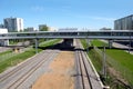 Urban industrial landscape railroad tracks and platform on sunny summer day Royalty Free Stock Photo