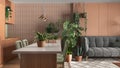 Urban jungle, kitchen with island and living room in white and orange tones. Sofa , carpet and houseplants. Home garden interior Royalty Free Stock Photo