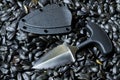 Urban knife with case on sunflower seed.. Diagonal position. Royalty Free Stock Photo