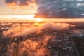 Urban landscape , aerial top view with low flying clouds over a residential area of the city, view of the horizon and the dawn of Royalty Free Stock Photo