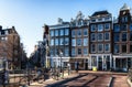 Urban landscape in Amsterdam Netherlands. Panorama street with bicycle tree and road traditional Dutch architecture