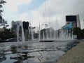 Urban landscape, a fountain over an avenue in Mexico City, on a cloudy day
