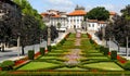 Urban landscape of Guimaraes in Portugal with its symmetrical gardens of green plants and colorful flowers, cathedral and Royalty Free Stock Photo