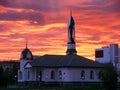 The urban landscape. Mosque at sunset.