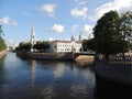 Urban landscape pedestrian bridge from river building bell tower and church