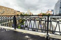 Urban landscape on rainy day. View of the Yauza river embankment through the bridge Visokoyauzskiy, Moscow, Russia. Royalty Free Stock Photo