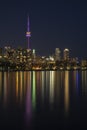 Toronto City skyline at night, clear dark sky, colorful light reflection in the calm water surface of lake Ontario. Royalty Free Stock Photo