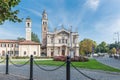 Traffic island with flowers. Shrine of Our Lady of the Miracles, Saronno, Italy Royalty Free Stock Photo