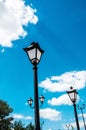 Urban lantern on a background of blue sky