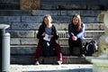 Urban life. Girls sitting in the sun 7