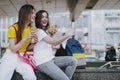 Happy female friends making selfie with hot dogs