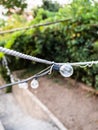 urban lighting - open electric light bulbs on wire