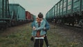 Urban Love Story. Young Couple Walking By The Railroad And Talking. They Cuddle. Royalty Free Stock Photo