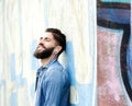 Urban man listening to music on earphones Royalty Free Stock Photo