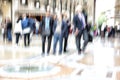 Urban move, people walking in city, motion blur, zoom effect Royalty Free Stock Photo