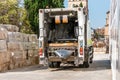 municipal recycling garbage collector truck riding at the city street in spain Royalty Free Stock Photo