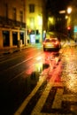 Old European city illuminated street at night, Lisbon, Portugal Royalty Free Stock Photo