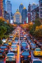 Urban night traffic long exposure light trails of fast moving cars on illuminated highway lane Royalty Free Stock Photo