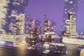 Urban nightly abstract background of skyscrapers with evening lights in the windows