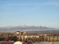 URBAN PANORAMA WITH MOUNTAIN VIEW, BLUE SKY