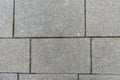 Urban paving slabs made of concrete square blocks as road surface texture Royalty Free Stock Photo